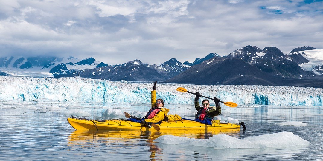 "Photo of a camper kayaking by a serene lake, representing recreational insurance coverage offered by an insurance company in Lancaster, Ohio."