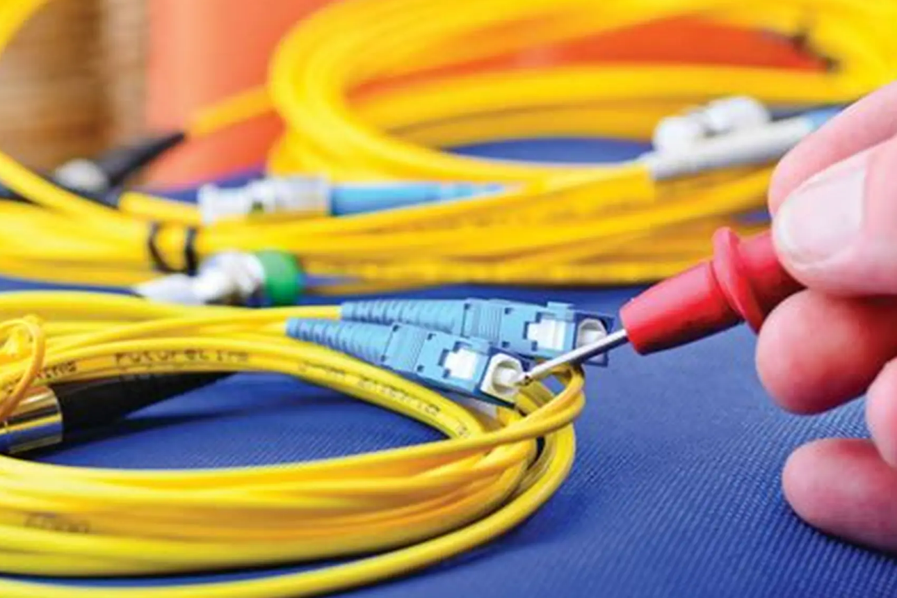 a bundle of colorful fiber optic cables, representing general liability insurance coverage for businesses in Lancaster, Ohio. This insurance provides protection against various risks associated with fiber optics installations and operations.